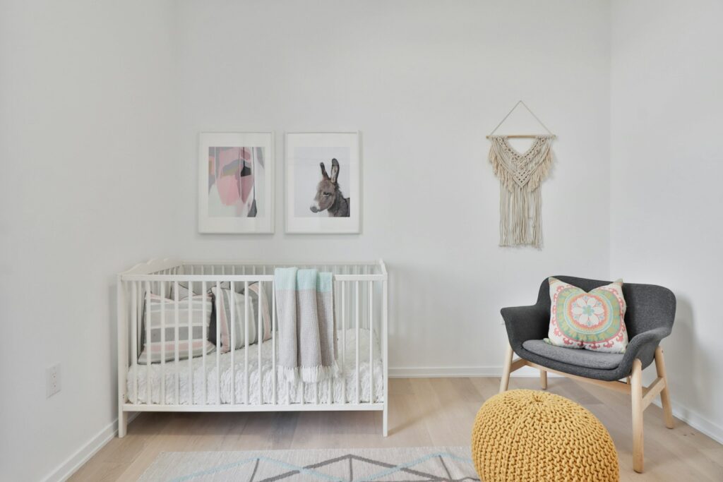 a bedroom with a bed and a chair in a room